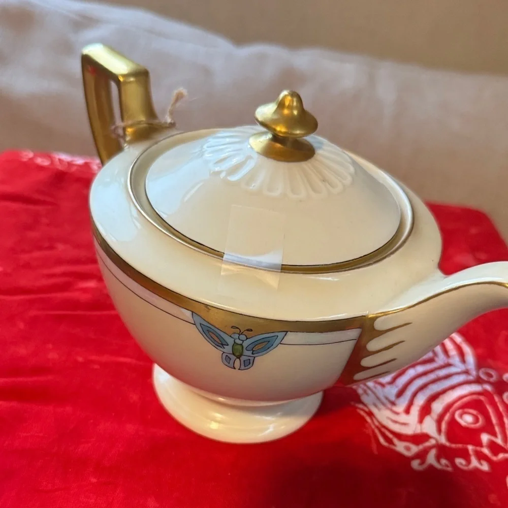 Elegant Gold and Cream Teapot with Blue Accents
